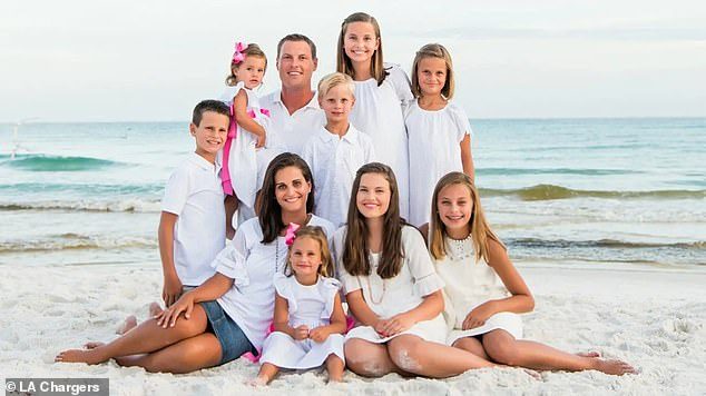 Philip Rivers kids and wife on a beach.